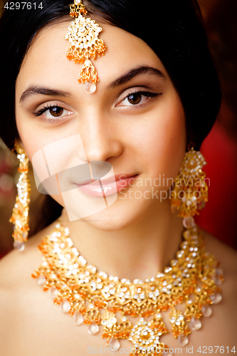 Image of beauty sweet real indian girl in sari smiling on black background