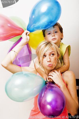 Image of pretty real family with color balloons on white background, blon