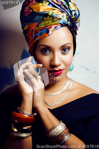 Image of beauty bright african woman with creative make up, shawl on head