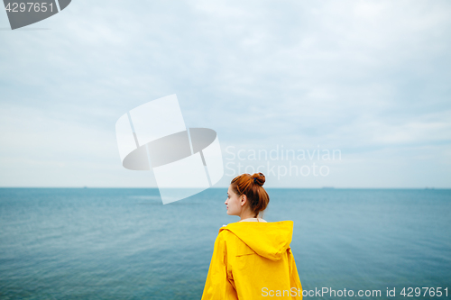 Image of Girl posing on background of ocean