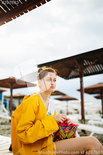 Image of Girl posing on pebble beach