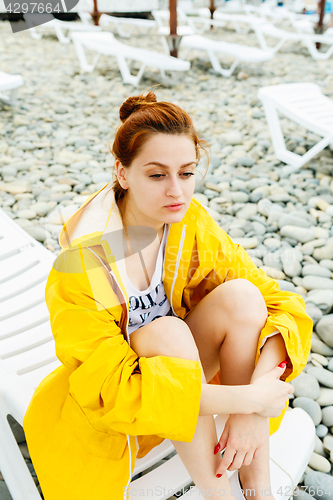 Image of Girl posing on pebble beach