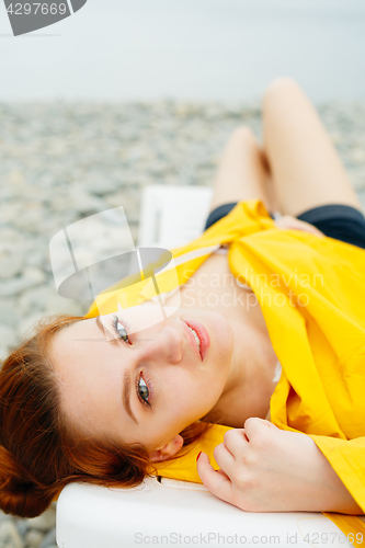 Image of Sensual girl posing on sunbed