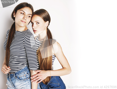 Image of two cute teenagers having fun together isolated on white