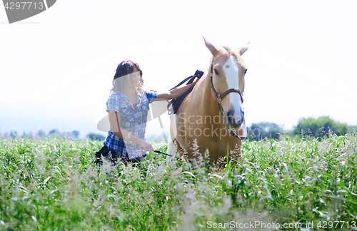 Image of Woman training her horse