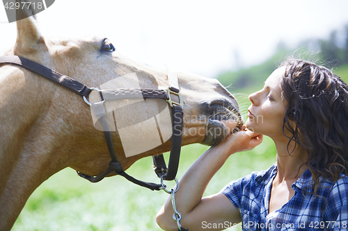 Image of Woman and horse together at paddock