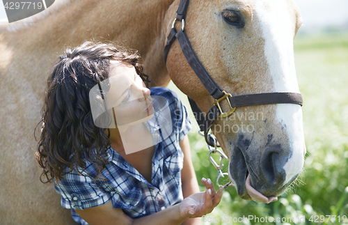 Image of Woman and horse together at paddock