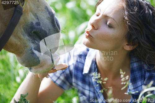 Image of Woman and horse together at paddock