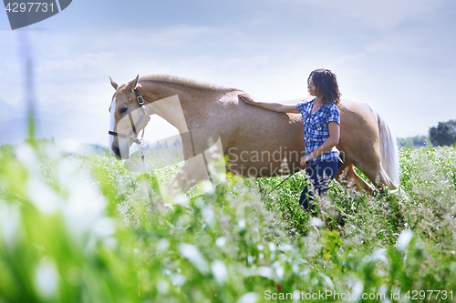 Image of Woman training her horse