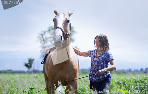 Image of Woman training her horse