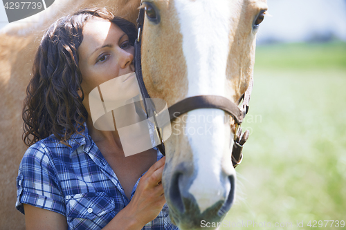 Image of Woman and horse together at paddock