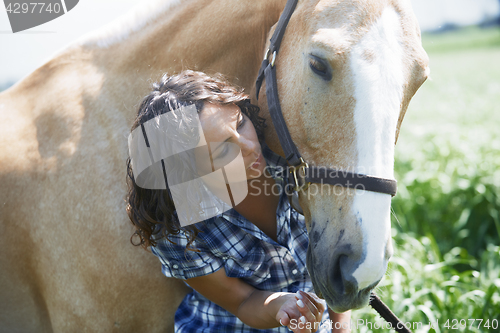 Image of Woman and horse together at paddock