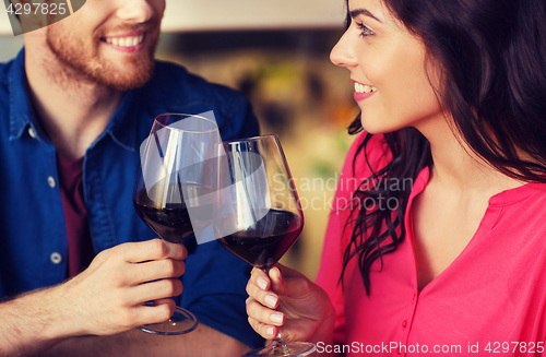 Image of happy couple dining and drink wine at restaurant