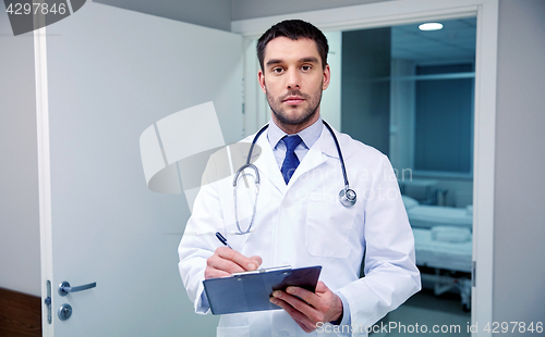 Image of doctor with stethoscope and clipboard at hospital