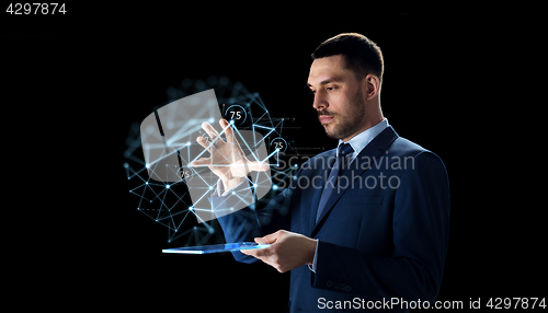 Image of businessman with tablet pc and low poly projection