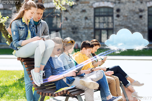 Image of group of students with tablet pc at school yard