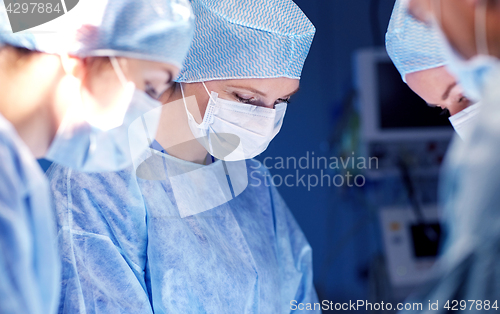 Image of group of surgeons in operating room at hospital