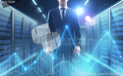 Image of businessman with virtual diagram charts