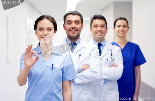 Image of group of happy medics or doctors at hospital