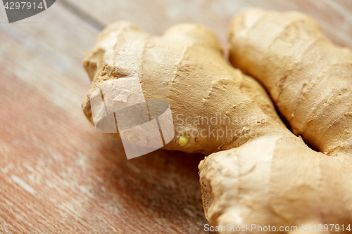 Image of close up of ginger root on wooden table