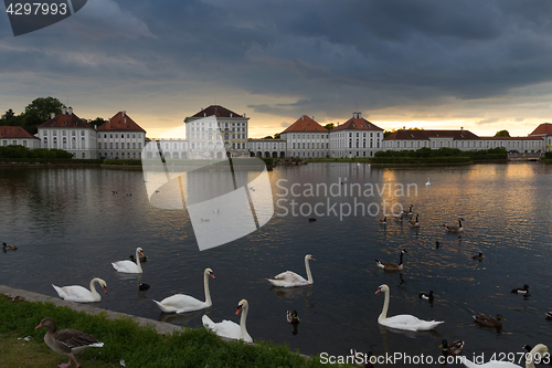 Image of Dramatic scenery of post storm sunset of Nymphenburg palace in Munich Germany.