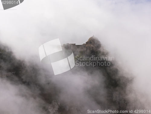 Image of Old church in clouds. Sicily, Italy.