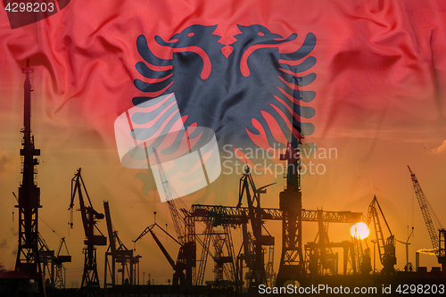 Image of Industrial concept with Albania flag at sunset