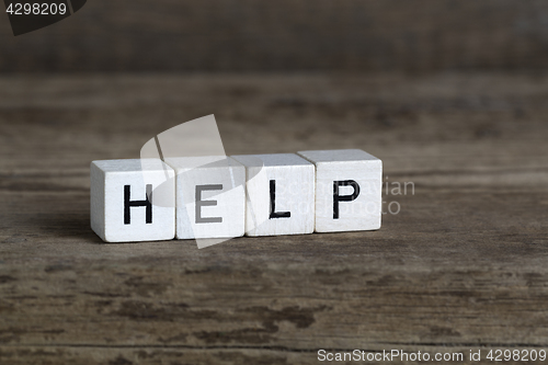 Image of Help, written in cubes