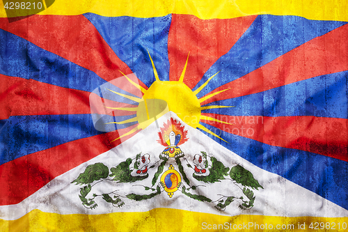 Image of Grunge style of Tibet flag on brick wall