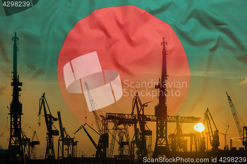 Image of Industrial concept with Bangladesh flag at sunset