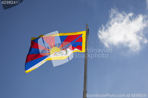 Image of National flag of Tibet on a flagpole