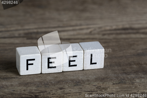 Image of Feel, written in cubes