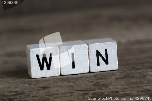 Image of Win, written in cubes