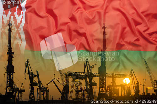 Image of Industrial concept with Belarus flag at sunset