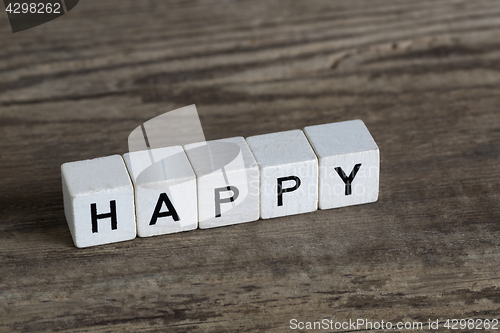 Image of Happy, written in cubes