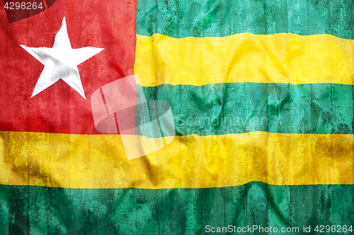 Image of Grunge style of Togo flag on brick wall