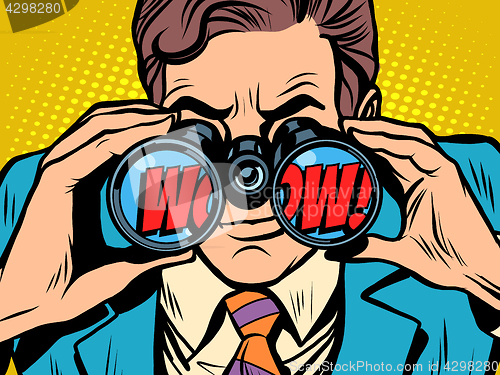 Image of wow Businessman looking through binoculars