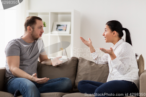 Image of unhappy couple having argument at home