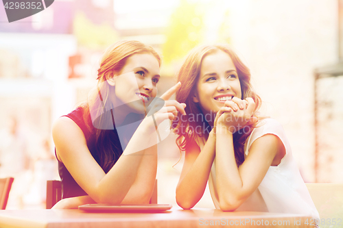 Image of happy young women or teenage girls with tablet pc
