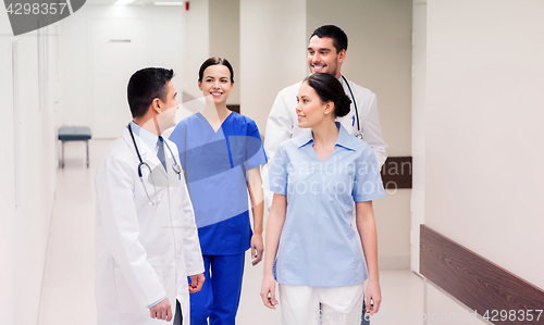 Image of group of happy medics or doctors at hospital