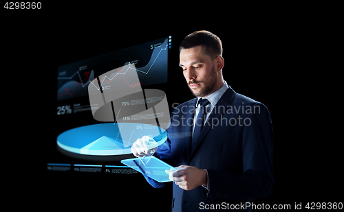 Image of businessman with tablet pc and virtual pie chart