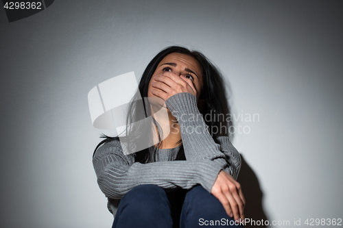 Image of sad crying woman suffering from domestic violence