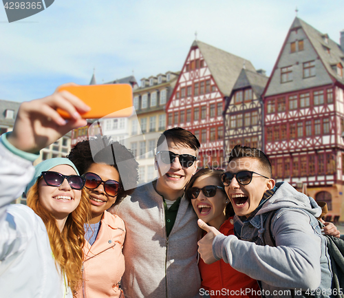 Image of friends taking selfie by smartphone in frankfurt