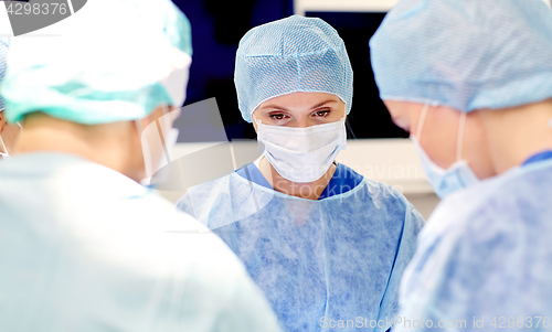 Image of group of surgeons in operating room at hospital