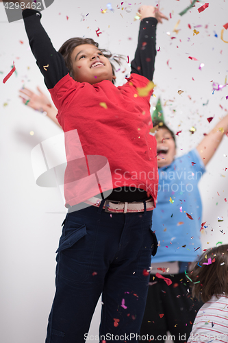 Image of kids  blowing confetti