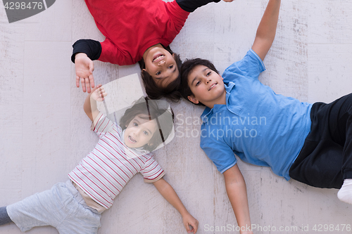 Image of young boys having fun on the floor