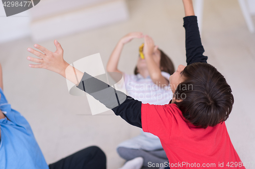 Image of young boys having fun on the floor