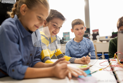 Image of happy kids with invention kit at robotics school