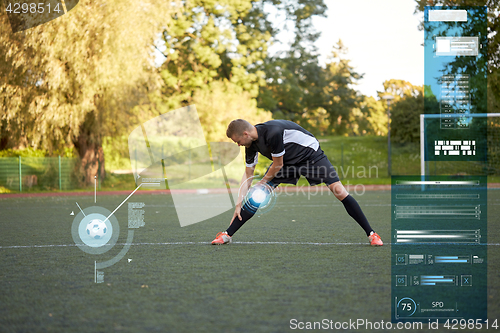 Image of soccer player stretching leg on field football