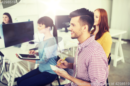 Image of creative team on conference or seminar at office